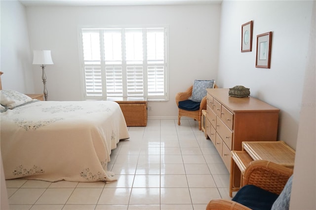 2325 Brookfield Greens Cir Unit 41, Sun City Center, FL 33573 - bedroom featuring light tile patterned floors and baseboards