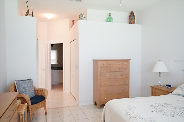 2325 Brookfield Greens Cir Unit 41, Sun City Center, FL 33573 - bedroom with light tile patterned floors and ensuite bathroom