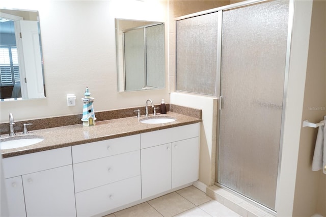 2325 Brookfield Greens Cir Unit 41, Sun City Center, FL 33573 - full bathroom featuring double vanity, a shower stall, and tile patterned flooring