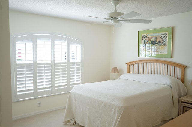 2325 Brookfield Greens Cir Unit 41, Sun City Center, FL 33573 - bedroom with multiple windows, a textured ceiling, and ceiling fan