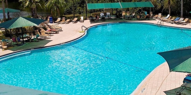 2325 Brookfield Greens Cir Unit 41, Sun City Center, FL 33573 - community pool featuring a patio area