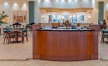 2325 Brookfield Greens Cir Unit 41, Sun City Center, FL 33573 - bar area featuring light tile patterned floors