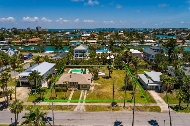 3111 S De Bazan Ave, St Pete Beach, FL 33706 - aerial view of residential area with property parcel outlined and a large body of water