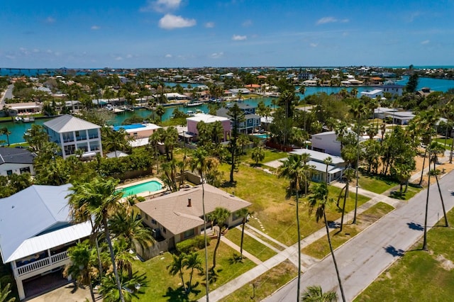 3111 S De Bazan Ave, St Pete Beach, FL 33706 - aerial perspective of suburban area with a nearby body of water and a pool area