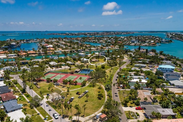 3111 S De Bazan Ave, St Pete Beach, FL 33706 - aerial perspective of suburban area with a large body of water
