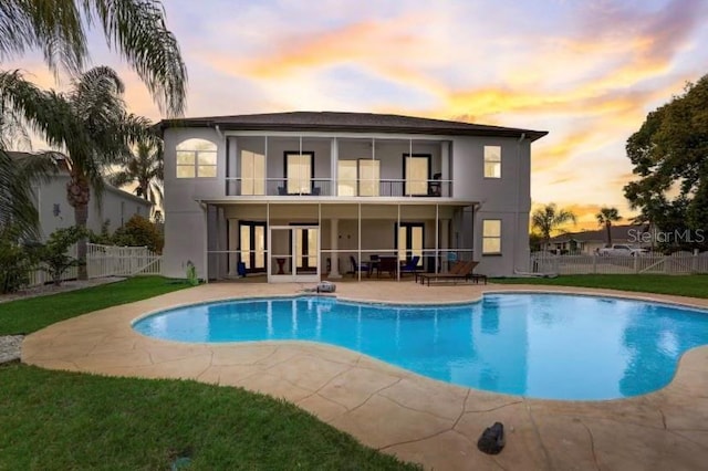 4353 Dewey Dr, New Port Richey, FL 34652 - back of house with french doors, a patio, a balcony, and stucco siding