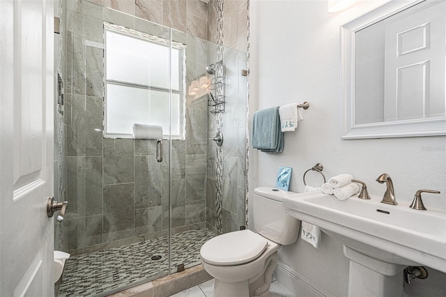 4353 Dewey Dr, New Port Richey, FL 34652 - bathroom featuring toilet, a shower stall, a sink, and baseboards