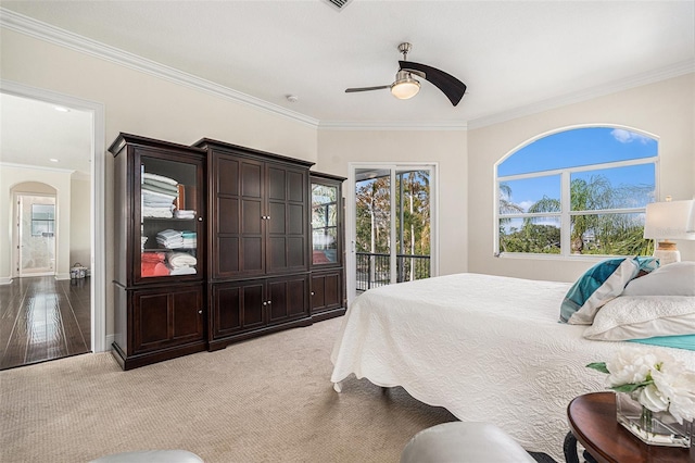 4353 Dewey Dr, New Port Richey, FL 34652 - carpeted bedroom with ornamental molding, access to outside, a ceiling fan, arched walkways, and baseboards