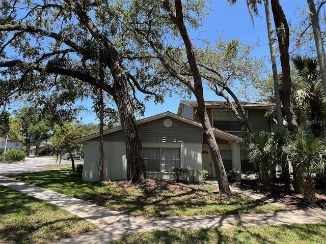 14667 Pine Glen Crk Unit 14667, Lutz, FL 33559 - view of front of house with a front yard and stucco siding