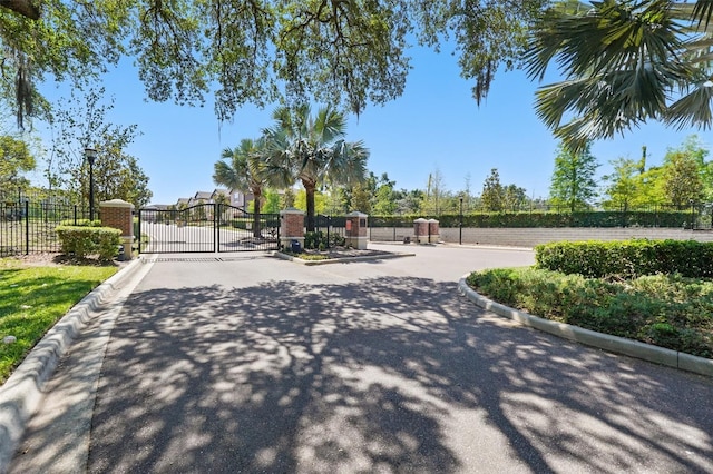 5024 Sylvester Loop, Tampa, FL 33610 - view of property's community with a gate