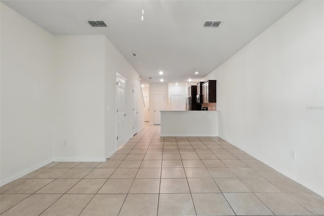 5024 Sylvester Loop, Tampa, FL 33610 - unfurnished living room featuring recessed lighting, baseboards, and light tile patterned floors