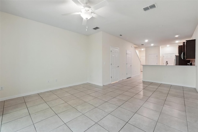 5024 Sylvester Loop, Tampa, FL 33610 - unfurnished living room featuring ceiling fan, light tile patterned floors, recessed lighting, and baseboards