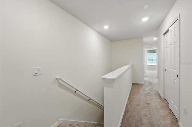 5024 Sylvester Loop, Tampa, FL 33610 - hallway with an upstairs landing, light carpet, baseboards, and recessed lighting
