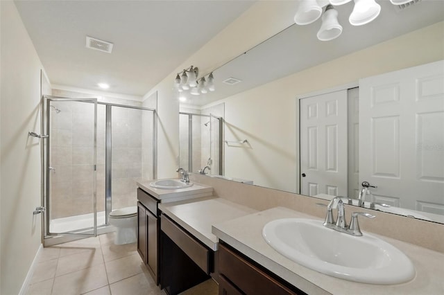 5024 Sylvester Loop, Tampa, FL 33610 - full bath with toilet, vanity, a stall shower, tile patterned flooring, and baseboards