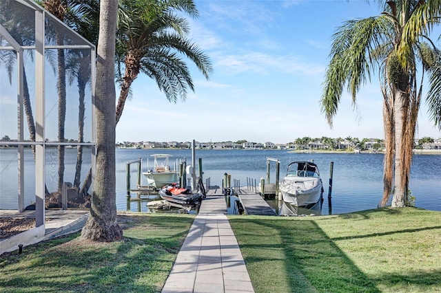 5225 Brighton Shore Dr, Apollo Beach, FL 33572 - dock area featuring boat lift, a lawn, and a water view