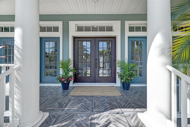 5225 Brighton Shore Dr, Apollo Beach, FL 33572 - doorway to property with french doors, covered porch, and stucco siding