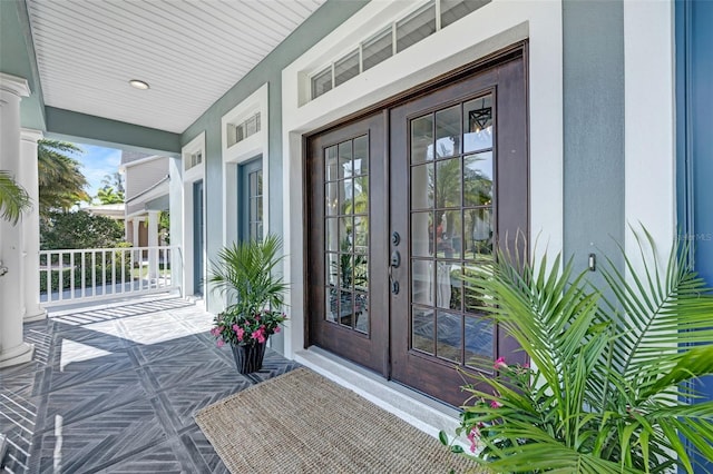 5225 Brighton Shore Dr, Apollo Beach, FL 33572 - entrance to property with a porch, french doors, and stucco siding