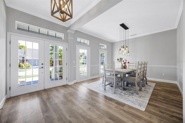 5225 Brighton Shore Dr, Apollo Beach, FL 33572 - dining space with a chandelier, baseboards, crown molding, wood finished floors, and french doors