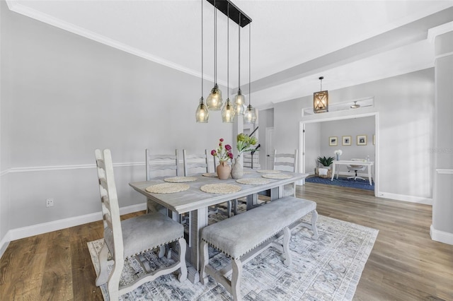 5225 Brighton Shore Dr, Apollo Beach, FL 33572 - dining room with baseboards, wood finished floors, and crown molding