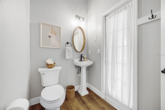 5225 Brighton Shore Dr, Apollo Beach, FL 33572 - half bathroom with toilet, wood finished floors, and baseboards