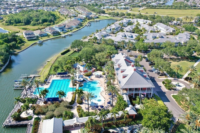 5225 Brighton Shore Dr, Apollo Beach, FL 33572 - aerial view of property and surrounding area featuring a large body of water, nearby suburban area, and a pool