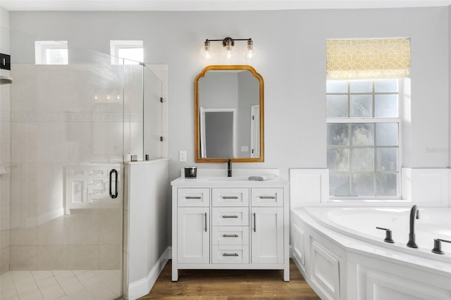 5225 Brighton Shore Dr, Apollo Beach, FL 33572 - bathroom with a shower stall, vanity, a bath, and wood finished floors
