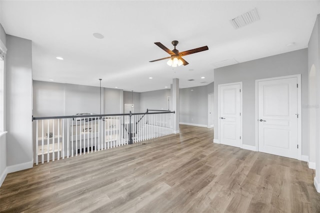 5225 Brighton Shore Dr, Apollo Beach, FL 33572 - unfurnished room featuring ceiling fan, wood finished floors, baseboards, and recessed lighting