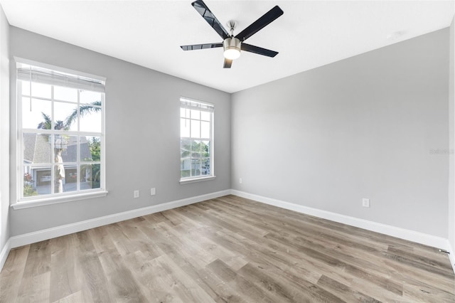 5225 Brighton Shore Dr, Apollo Beach, FL 33572 - spare room featuring wood finished floors, baseboards, and ceiling fan