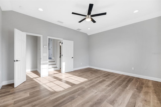5225 Brighton Shore Dr, Apollo Beach, FL 33572 - unfurnished bedroom featuring wood finished floors, baseboards, lofted ceiling, recessed lighting, and a ceiling fan