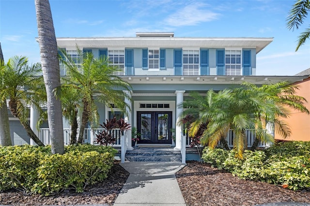 5225 Brighton Shore Dr, Apollo Beach, FL 33572 - view of exterior entry featuring french doors and covered porch
