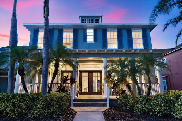 5225 Brighton Shore Dr, Apollo Beach, FL 33572 - view of front of house featuring french doors and a porch