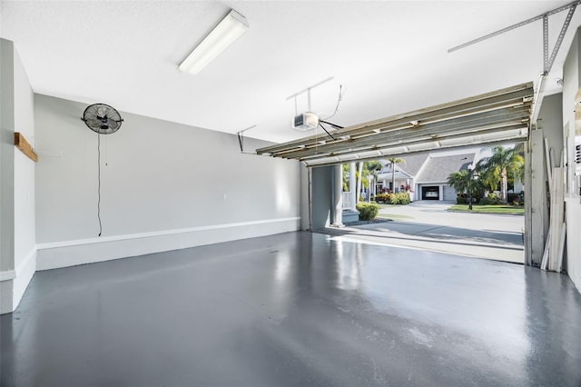 5225 Brighton Shore Dr, Apollo Beach, FL 33572 - garage with baseboards and a garage door opener
