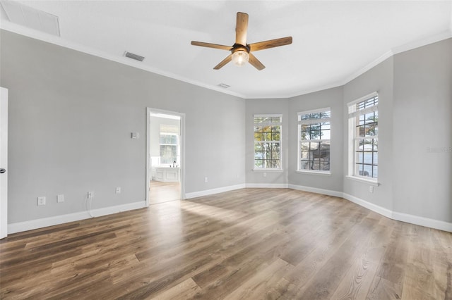 5225 Brighton Shore Dr, Apollo Beach, FL 33572 - empty room with ceiling fan, crown molding, wood finished floors, and baseboards