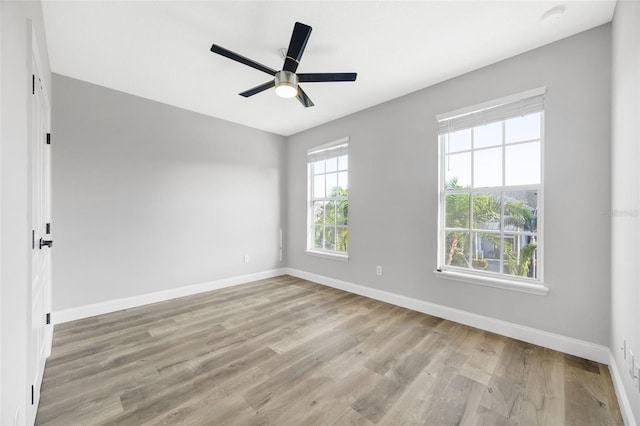 5225 Brighton Shore Dr, Apollo Beach, FL 33572 - spare room with baseboards, wood finished floors, and ceiling fan