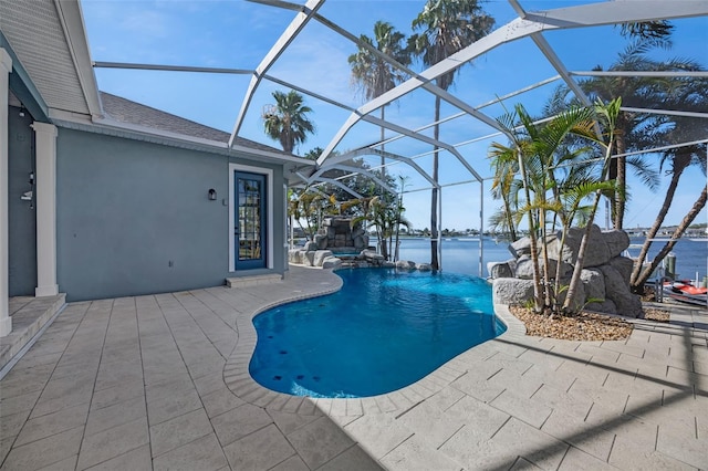 5225 Brighton Shore Dr, Apollo Beach, FL 33572 - outdoor pool with a patio area, glass enclosure, and a water view