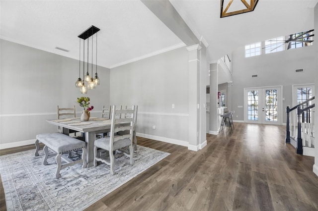 5225 Brighton Shore Dr, Apollo Beach, FL 33572 - dining space with wood finished floors, decorative columns, crown molding, french doors, and a chandelier