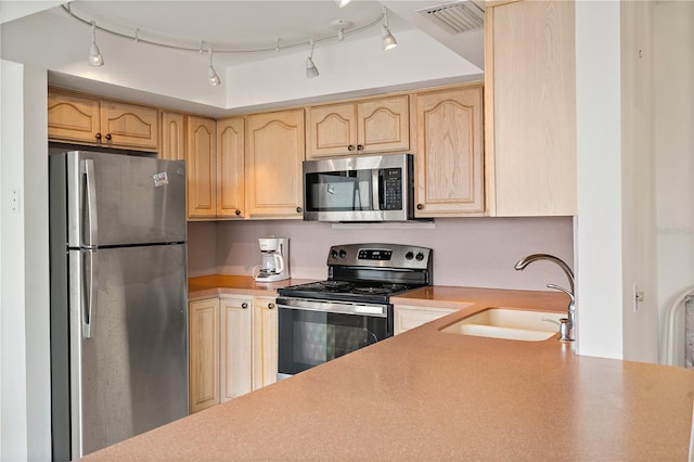 6269 Palma Del Mar Blvd S Unit 306, Saint Petersburg, FL 33715 - kitchen with stainless steel appliances, a sink, light brown cabinets, and light countertops