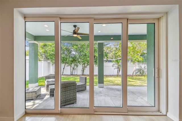 511 Roanoke St, Dunedin, FL 34698 - doorway to outside featuring a ceiling fan and baseboards