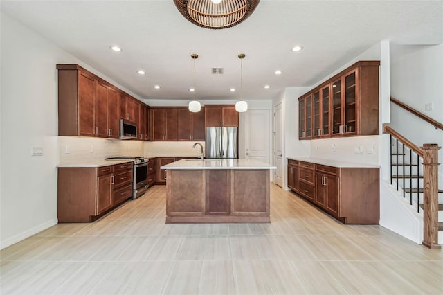 511 Roanoke St, Dunedin, FL 34698 - kitchen with stainless steel appliances, light countertops, a sink, glass insert cabinets, and tasteful backsplash