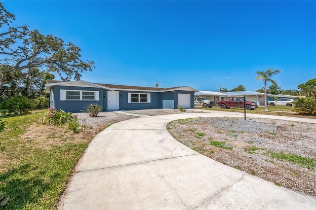 315 Dorchester Dr, Venice, FL 34293 - ranch-style house featuring a garage, driveway, and stucco siding