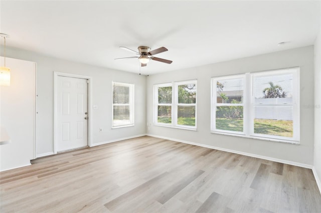 315 Dorchester Dr, Venice, FL 34293 - spare room with a ceiling fan, light wood-style floors, and baseboards