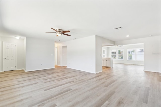 315 Dorchester Dr, Venice, FL 34293 - unfurnished living room with a ceiling fan, light wood-style flooring, baseboards, and recessed lighting