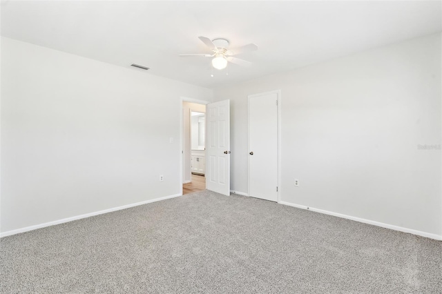 315 Dorchester Dr, Venice, FL 34293 - spare room featuring light colored carpet, a ceiling fan, and baseboards