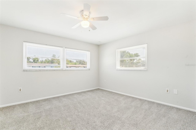 315 Dorchester Dr, Venice, FL 34293 - unfurnished room with healthy amount of natural light, carpet floors, baseboards, and a ceiling fan