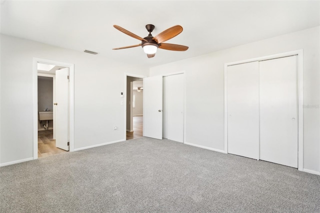 315 Dorchester Dr, Venice, FL 34293 - unfurnished bedroom featuring multiple closets, carpet flooring, baseboards, and ensuite bathroom