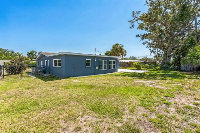 315 Dorchester Dr, Venice, FL 34293 - back of house featuring stucco siding