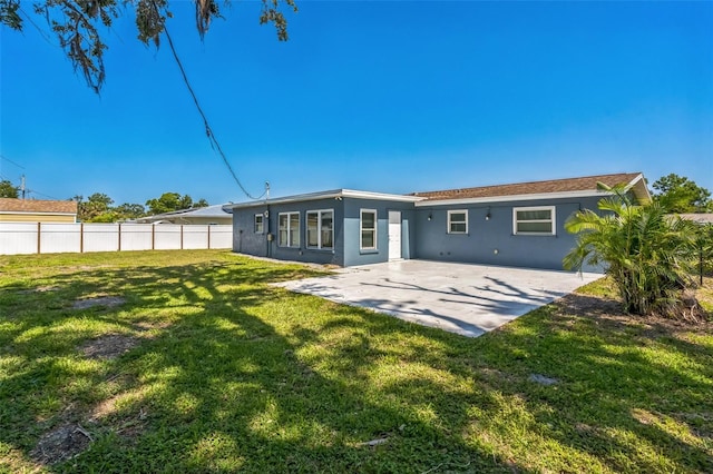 315 Dorchester Dr, Venice, FL 34293 - rear view of property featuring stucco siding and a patio