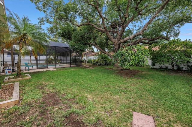 9674 104th Ave, Largo, FL 33773 - view of green lawn featuring glass enclosure