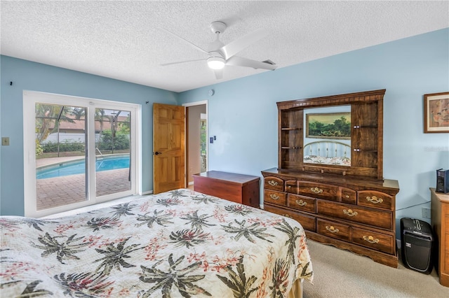 9674 104th Ave, Largo, FL 33773 - carpeted bedroom with access to outside, a textured ceiling, and ceiling fan