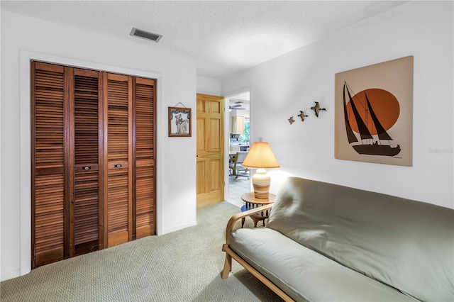 9674 104th Ave, Largo, FL 33773 - living area featuring carpet and a textured ceiling